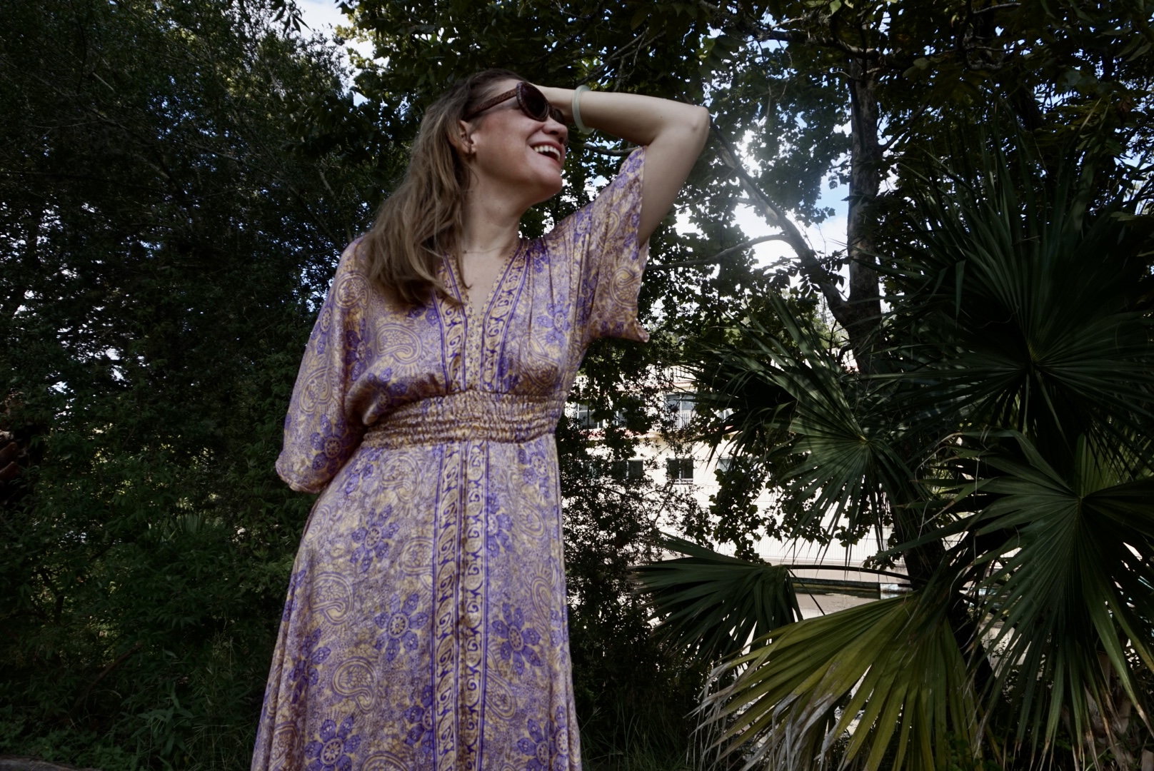 a woman in a gold and purple caftan