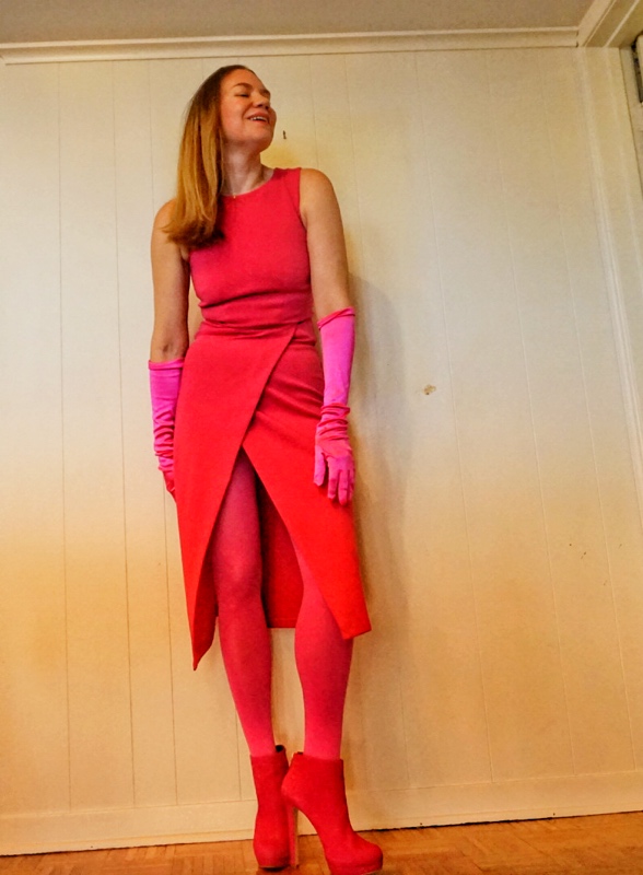 a woman in a hot pink dress, tights, boots, and gloves
