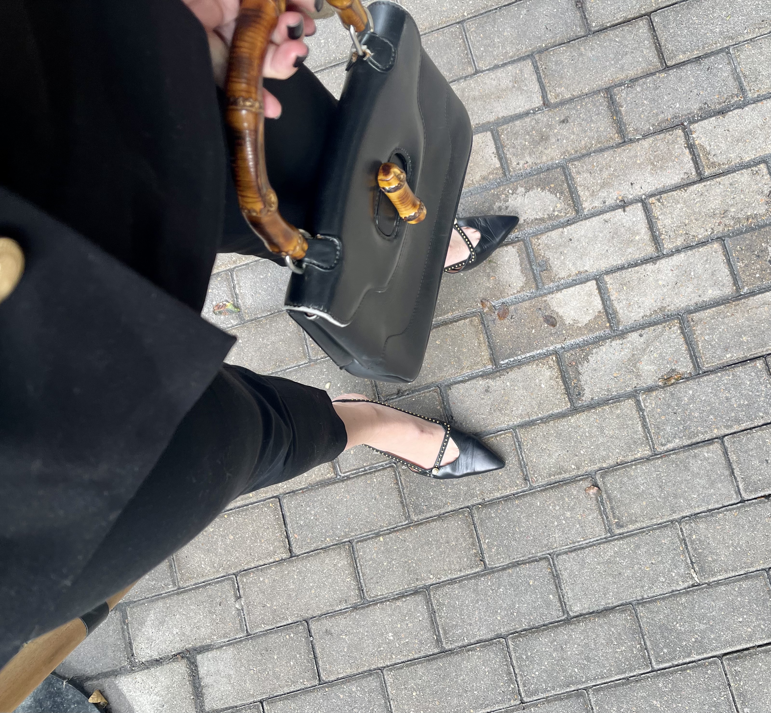 black pants, kitten heels, bamboo Gucci bag