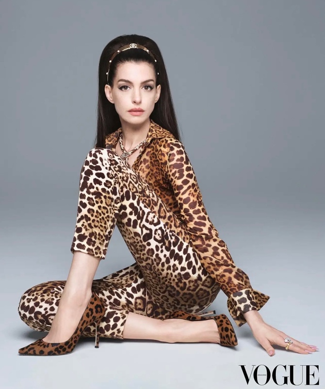 Anne Hathaway in leopard print pants and a top, with leopard shoes