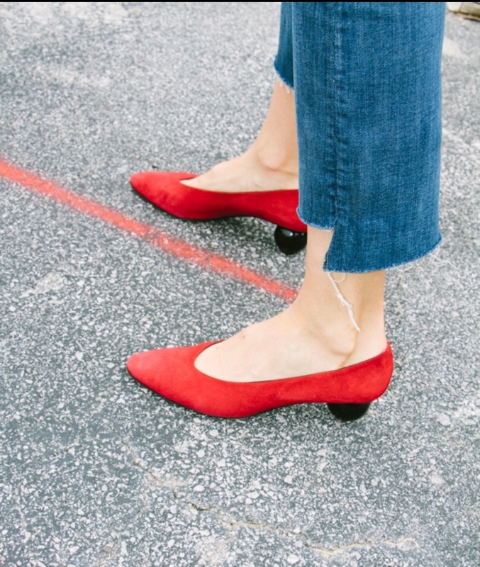 close up of red kitten heels 