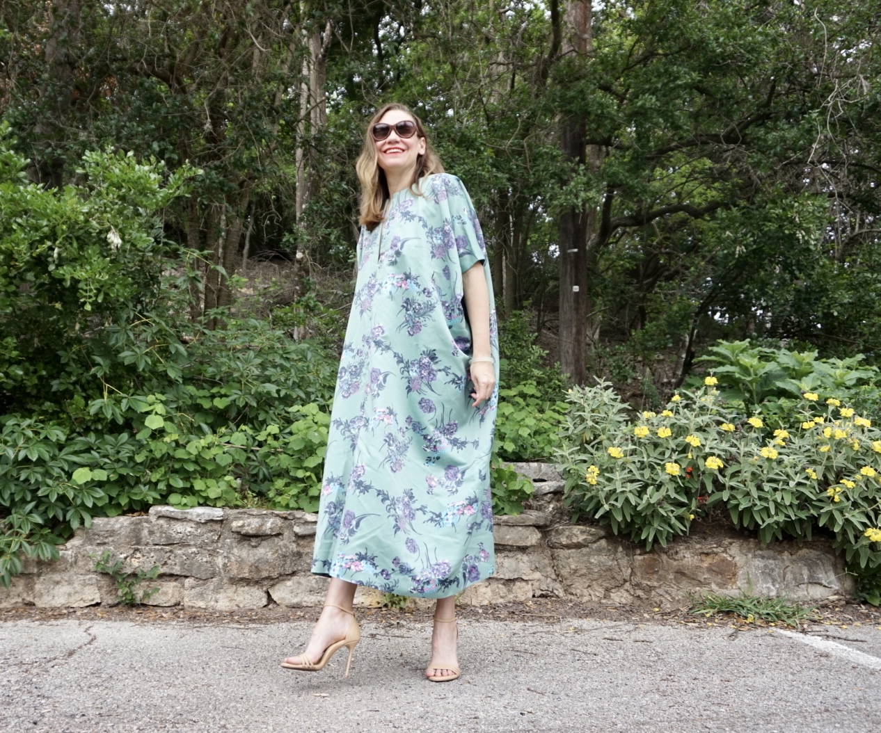 a woman in a green floral caftan