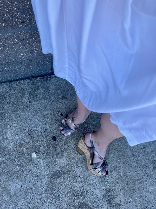 close up of snake wedges and a white skirt