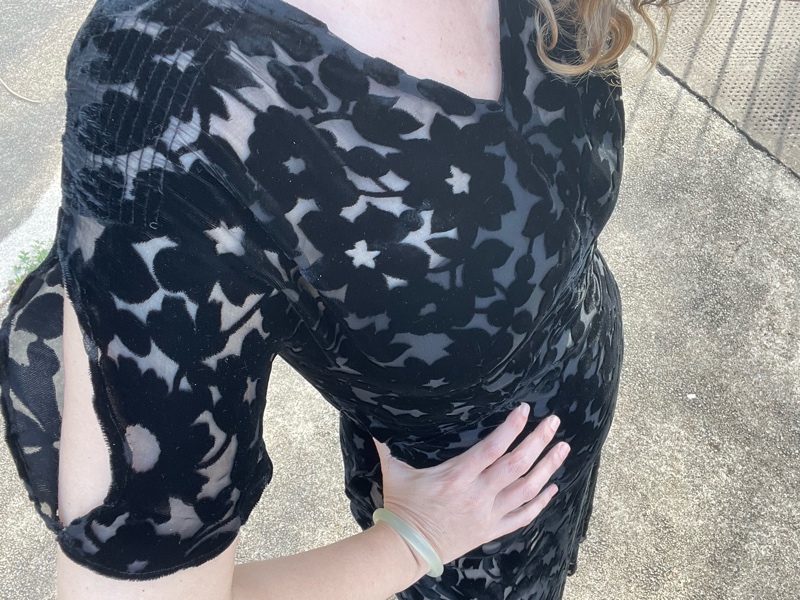 a woman in a burnout velvet vintage dress with a swimsuit underneath and wedge shoes