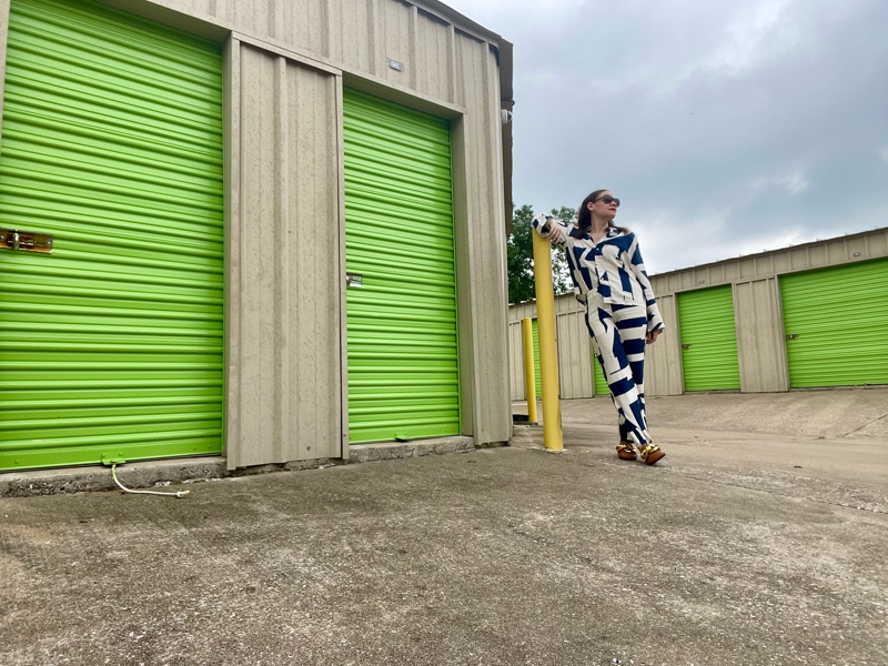 a woman in a white and blue line pant set